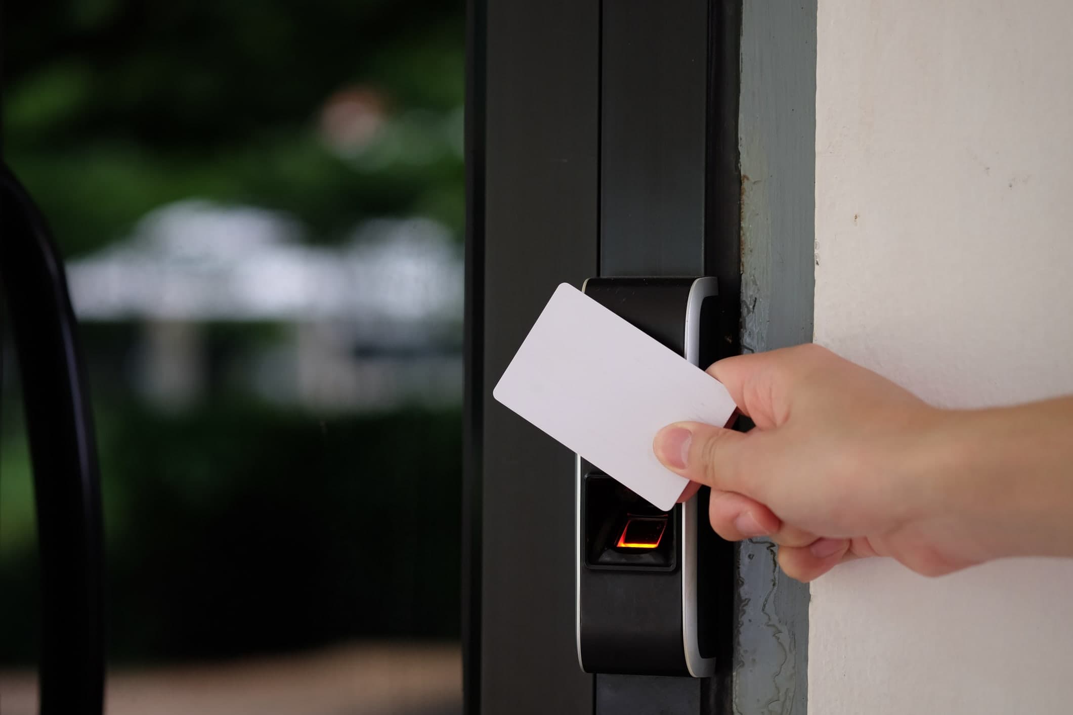 Access card being presented to a building card reader